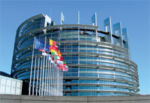 View of the European Parliament building with flags in Strasbourg